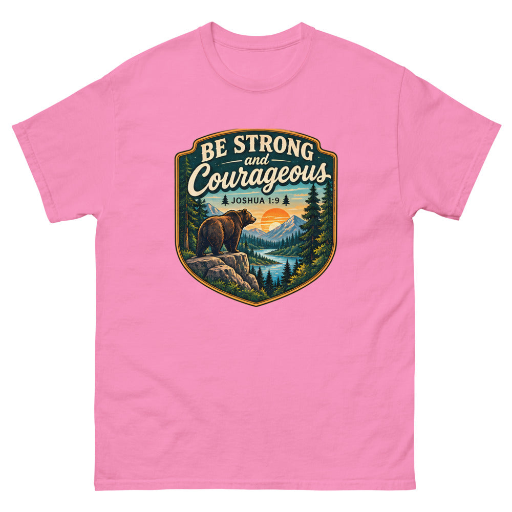 Shield badge with a bear on a rock reading Be Strong And Courageous on a Azalea shirt