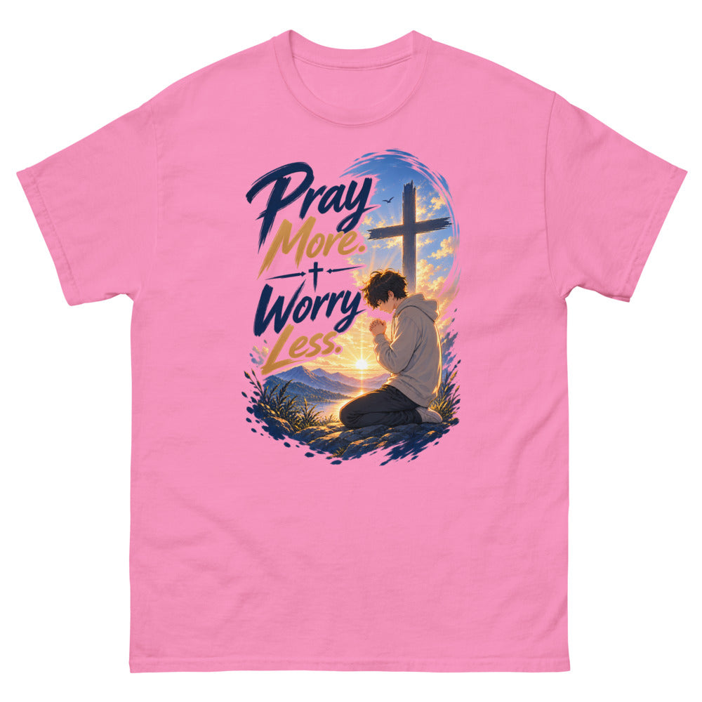 Anime boy kneeling in prayer at sunrise beneath a cross with the words Pray More Worry Less on a Azalea shirt