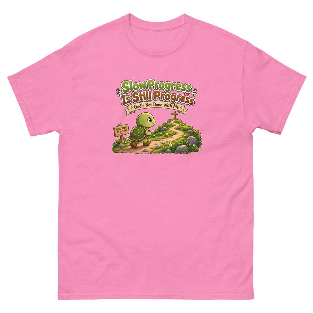 Cartoon turtle walking a path toward a cross with the words Slow Progress Is Still Progress on a Azalea shirt