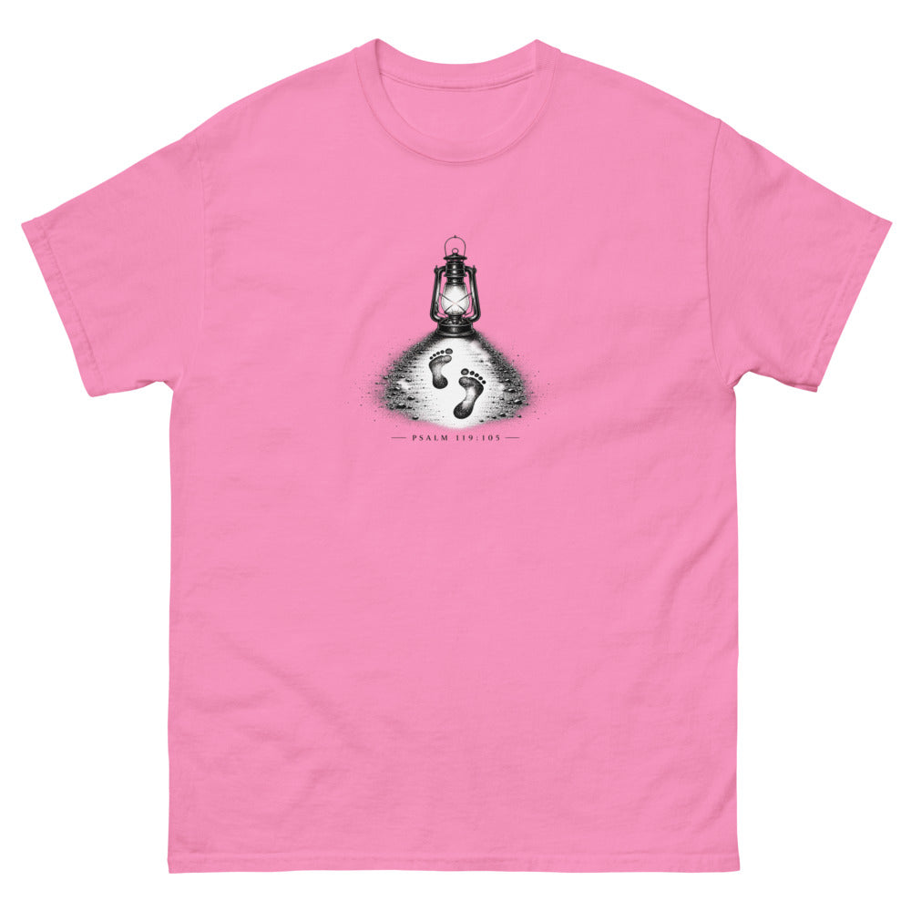 Stippled lantern lighting two footprints in sand with Psalm 119:105 on a Azalea shirt