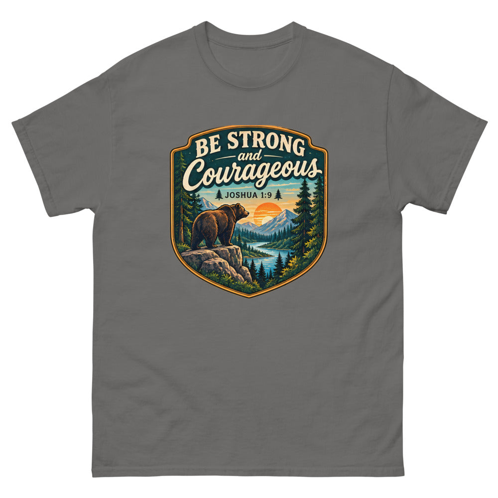 Shield badge with a bear on a rock reading Be Strong And Courageous on a Charcoal shirt