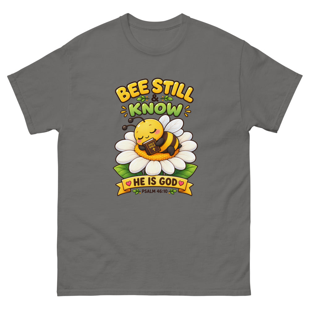 Cartoon bee sleeping on a daisy with a Bible and the words Bee Still And Know on a Charcoal shirt