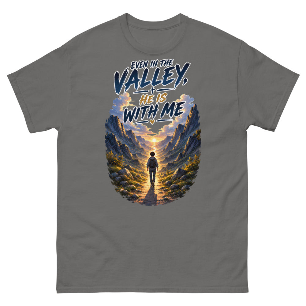 Hiker walking through a mountain valley with the words Even In The Valley He Is With Me on a Charcoal shirt