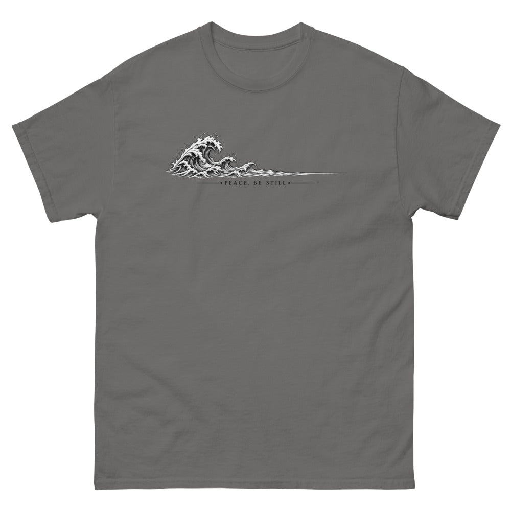 Engraved line art wave with the words Peace Be Still on a Charcoal shirt