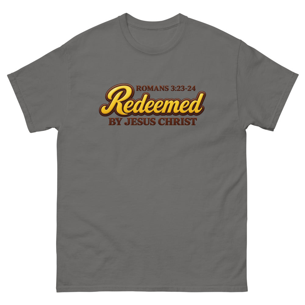 Glossy gold and brown candy script reading Redeemed by Jesus Christ, Romans 3:23-24 on a Charcoal shirt