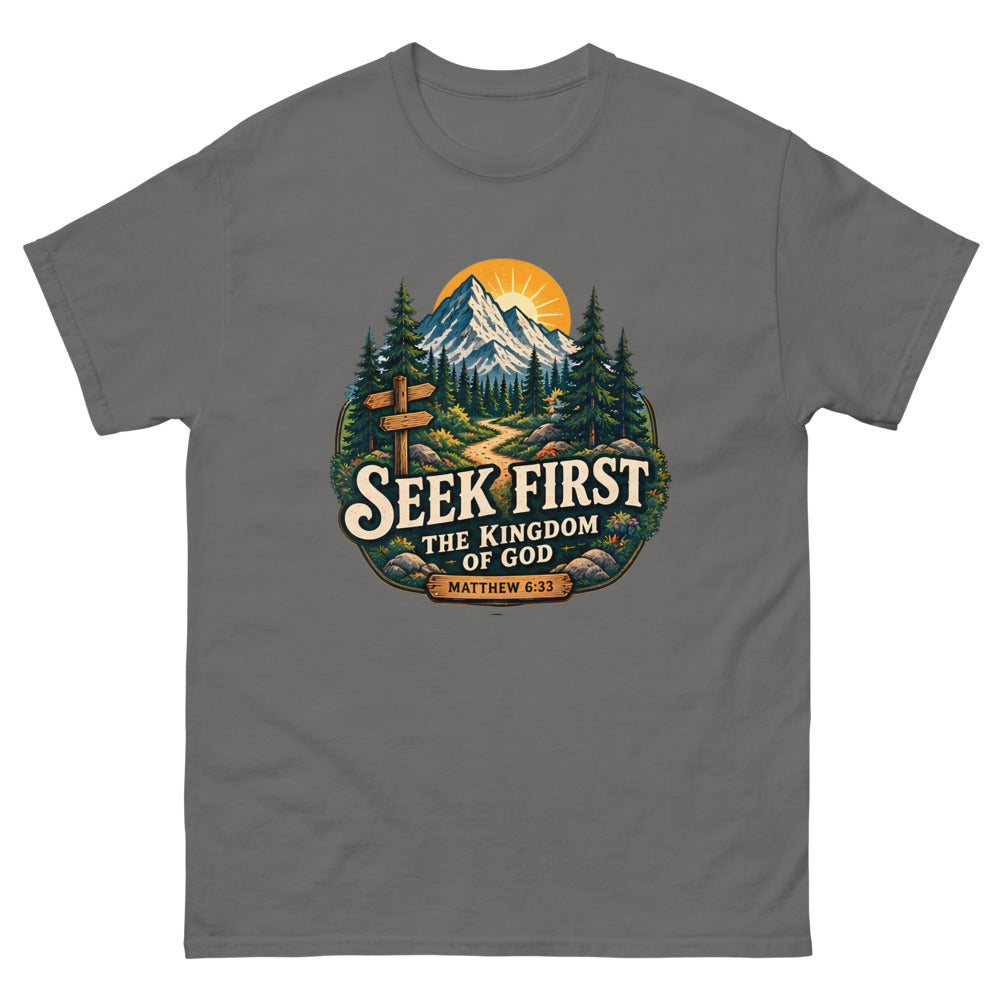 Vintage trail badge with mountains and a signpost reading Seek First The Kingdom Of God on a Charcoal shirt