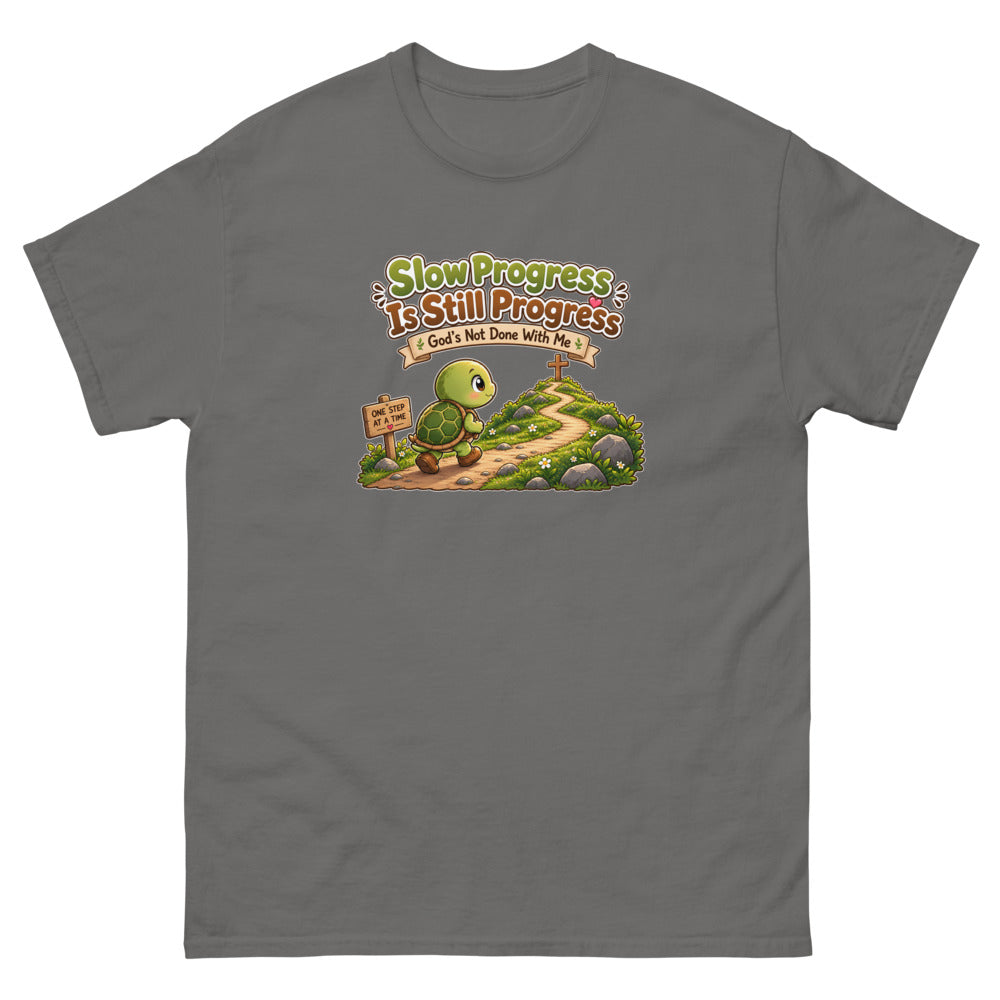 Cartoon turtle walking a path toward a cross with the words Slow Progress Is Still Progress on a Charcoal shirt