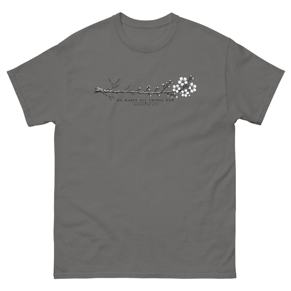 Line art branch flowering from bare to bloom with the words He Makes All Things New on a Charcoal shirt