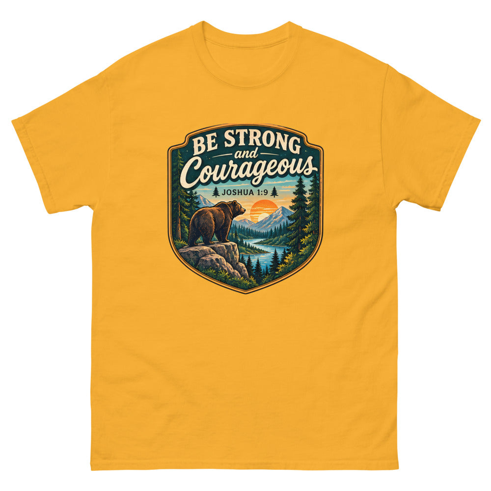 Shield badge with a bear on a rock reading Be Strong And Courageous on a Gold shirt
