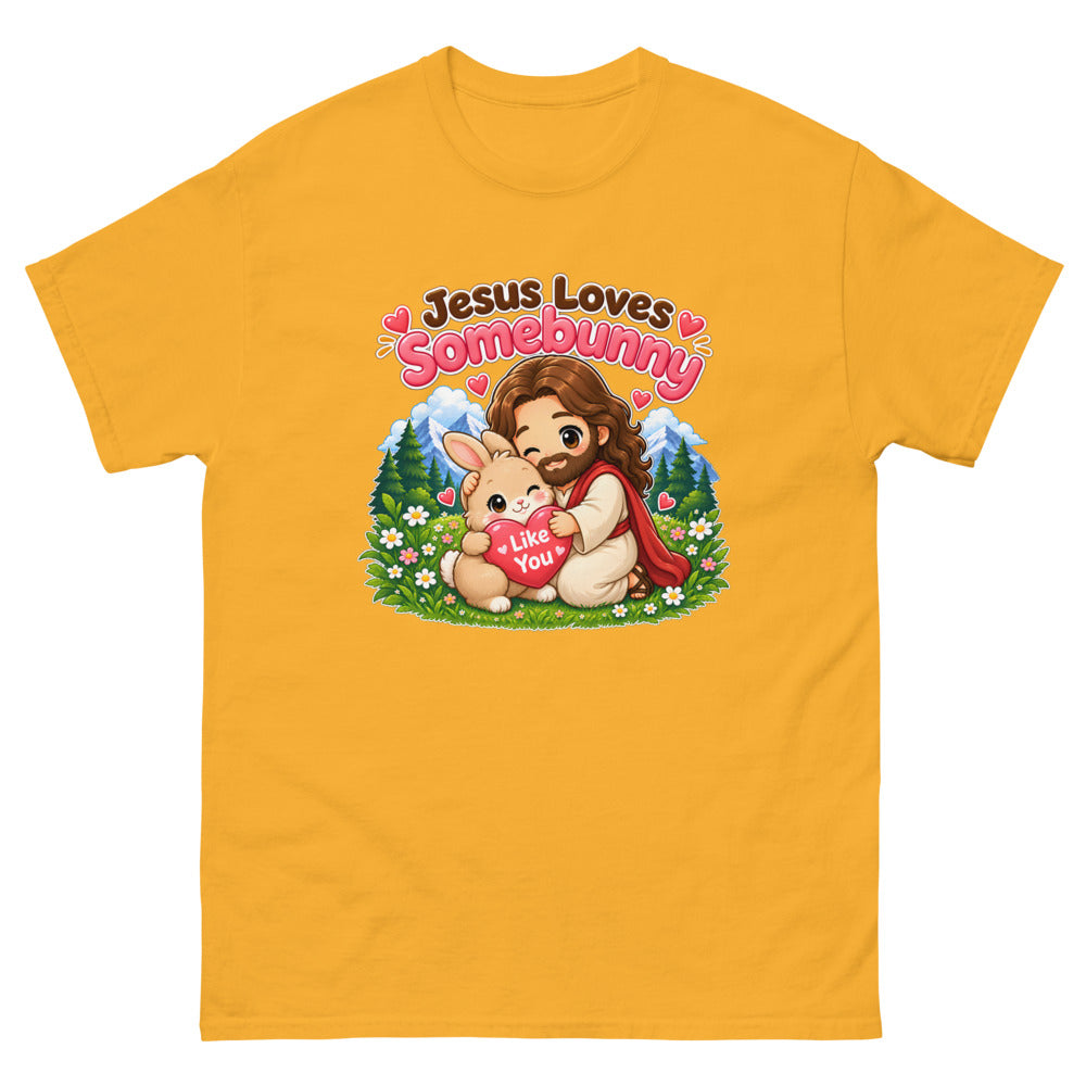 Chibi Jesus hugging a bunny holding a heart with the words Jesus Loves Somebunny on a Gold shirt