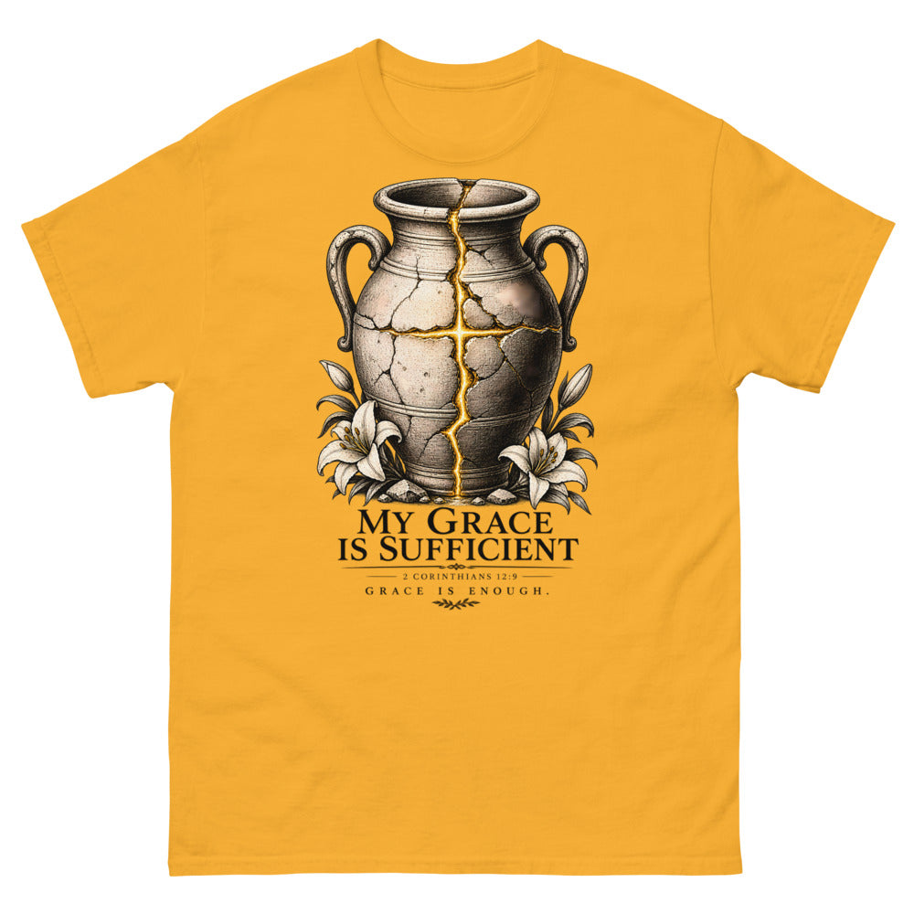 Cracked vessel repaired with gold seams forming a cross, reading My Grace Is Sufficient on a Gold shirt