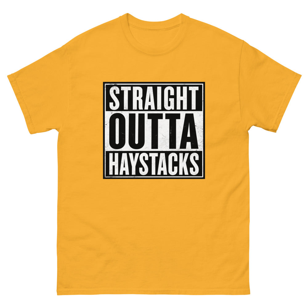 Distressed block lettering reading Straight Outta Haystacks on a Gold shirt