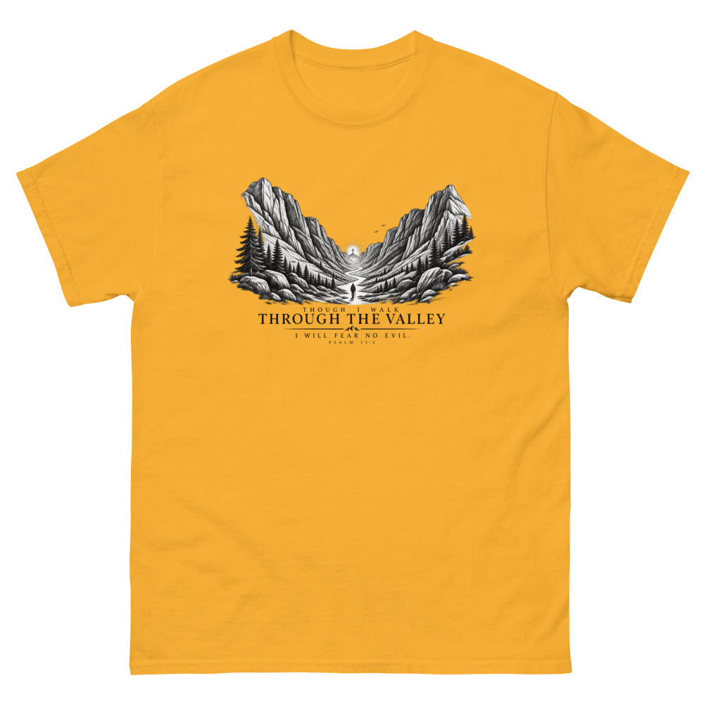 Engraved mountain valley with a lone figure reading Though I Walk Through The Valley I Will Fear No Evil on a Gold shirt