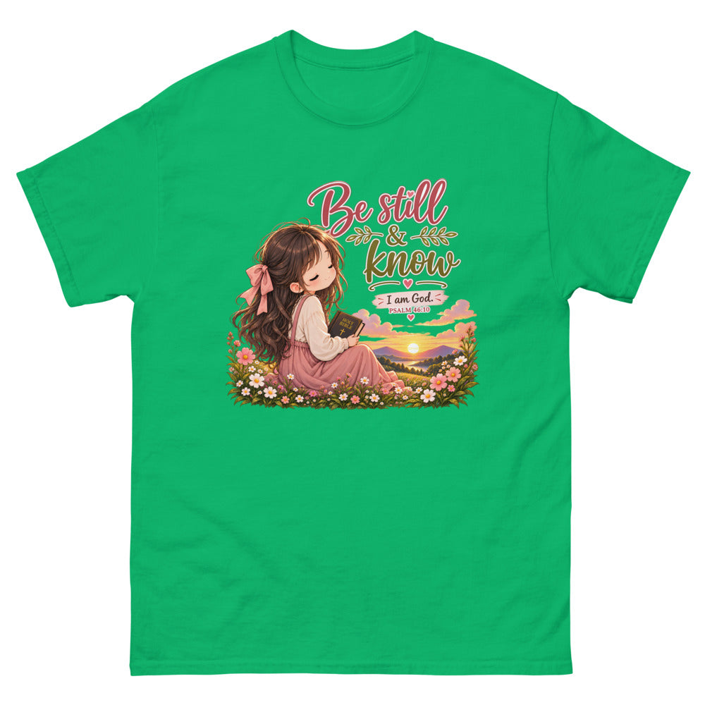 Chibi girl in a flower field holding a Bible with the words Be Still And Know on a Irish Green shirt
