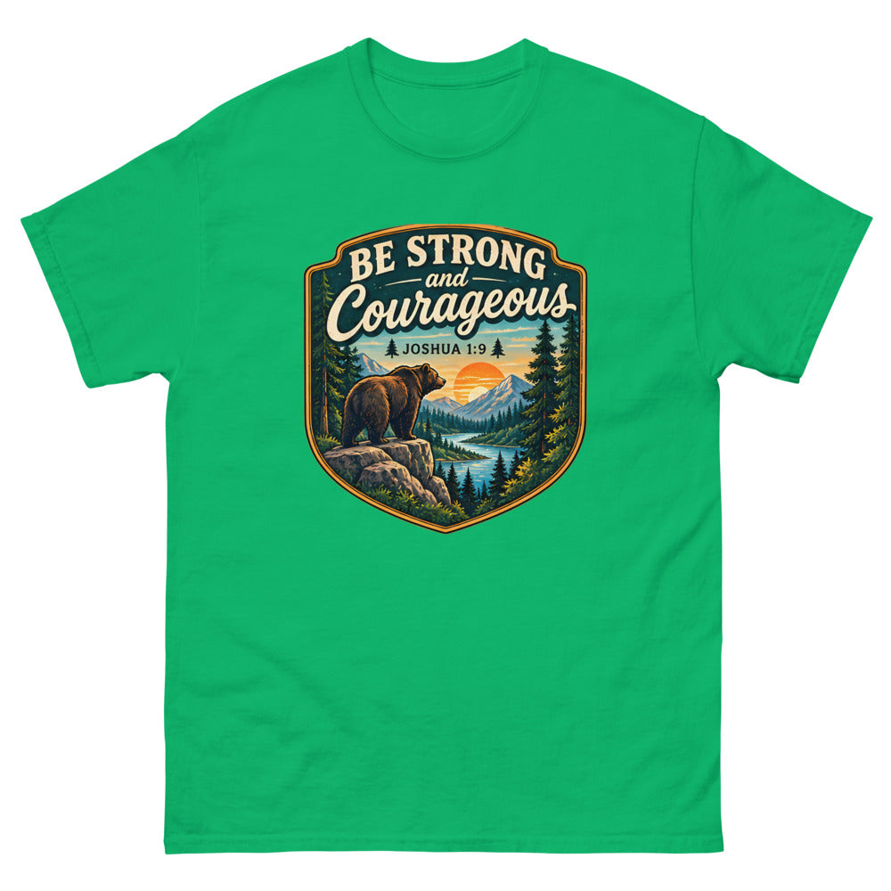 Shield badge with a bear on a rock reading Be Strong And Courageous on a Irish Green shirt