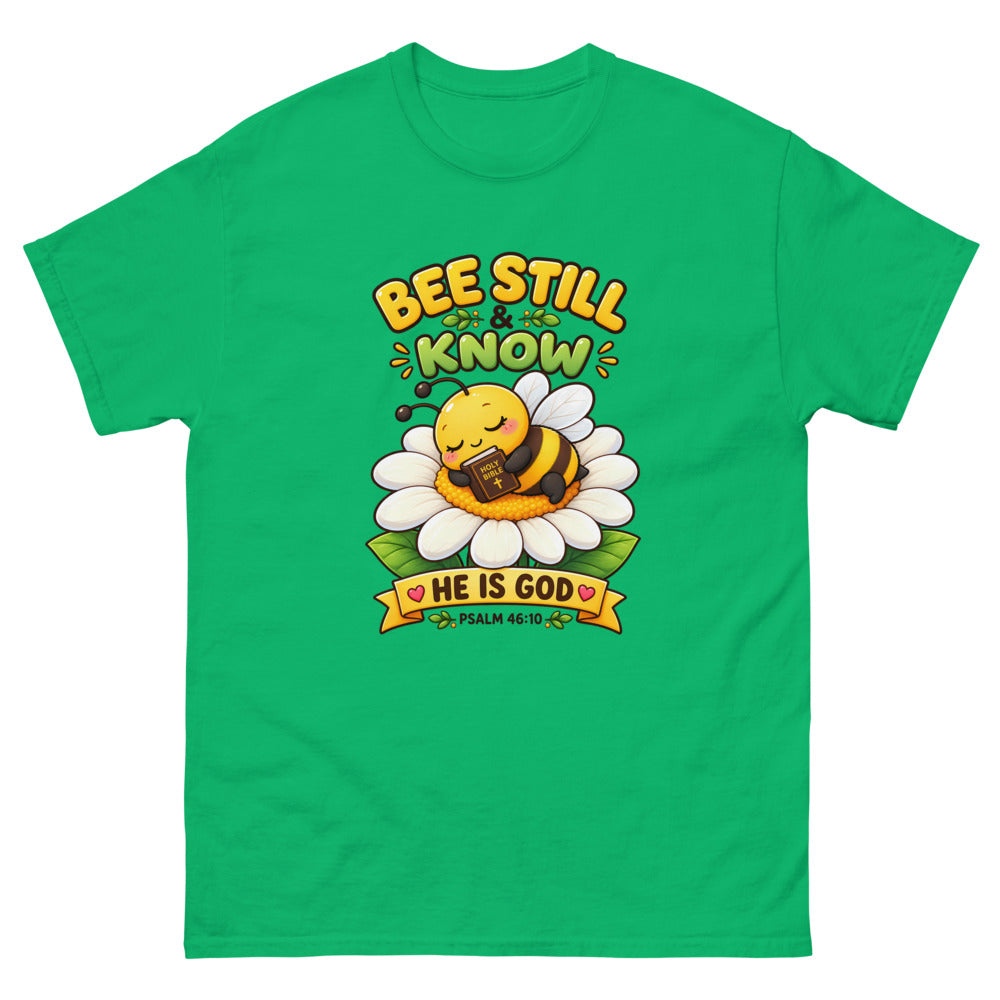 Cartoon bee sleeping on a daisy with a Bible and the words Bee Still And Know on a Irish Green shirt