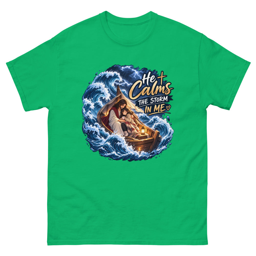 Jesus holding a young woman in a boat during a storm with the words He Calms The Storm In Me on a Irish Green shirt