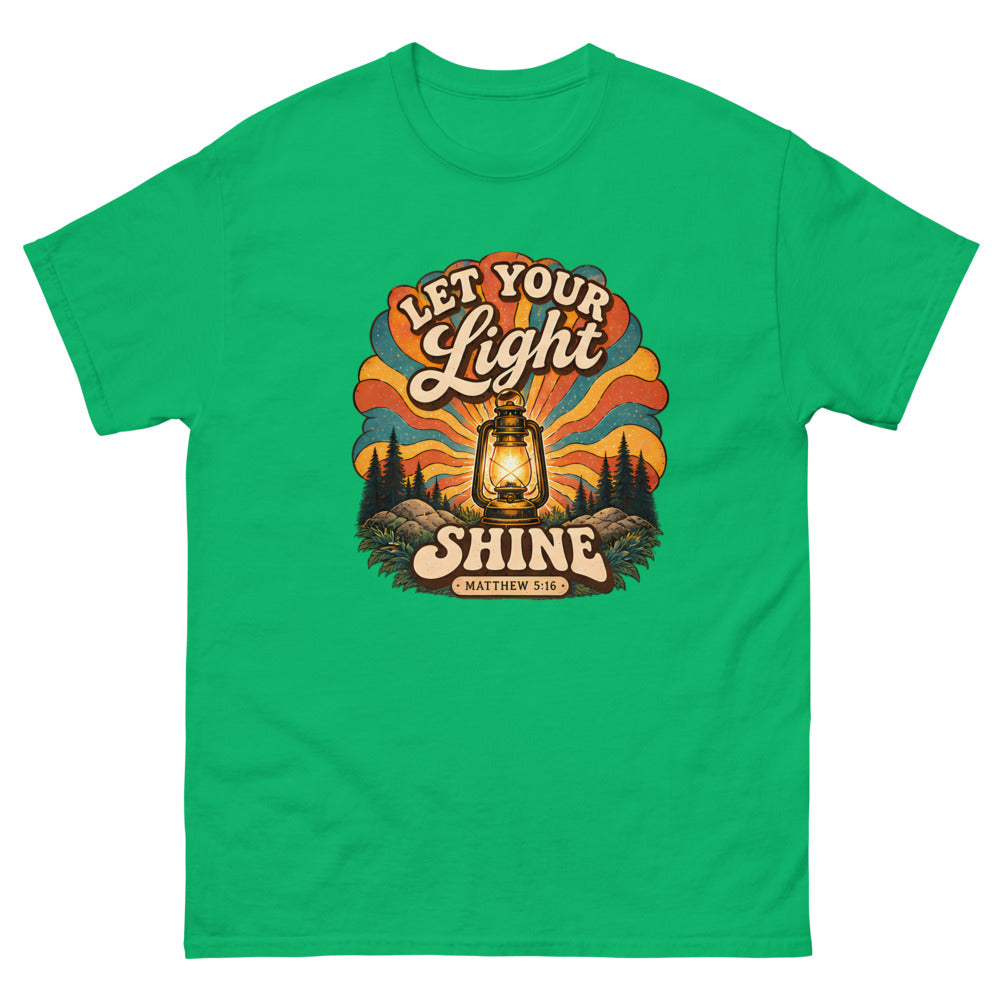 Retro lantern glowing against sunburst rays reading Let Your Light Shine on a Irish Green shirt