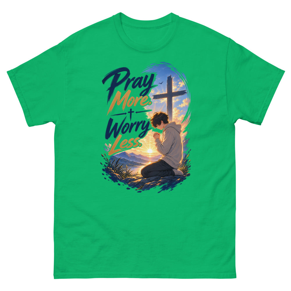 Anime boy kneeling in prayer at sunrise beneath a cross with the words Pray More Worry Less on a Irish Green shirt