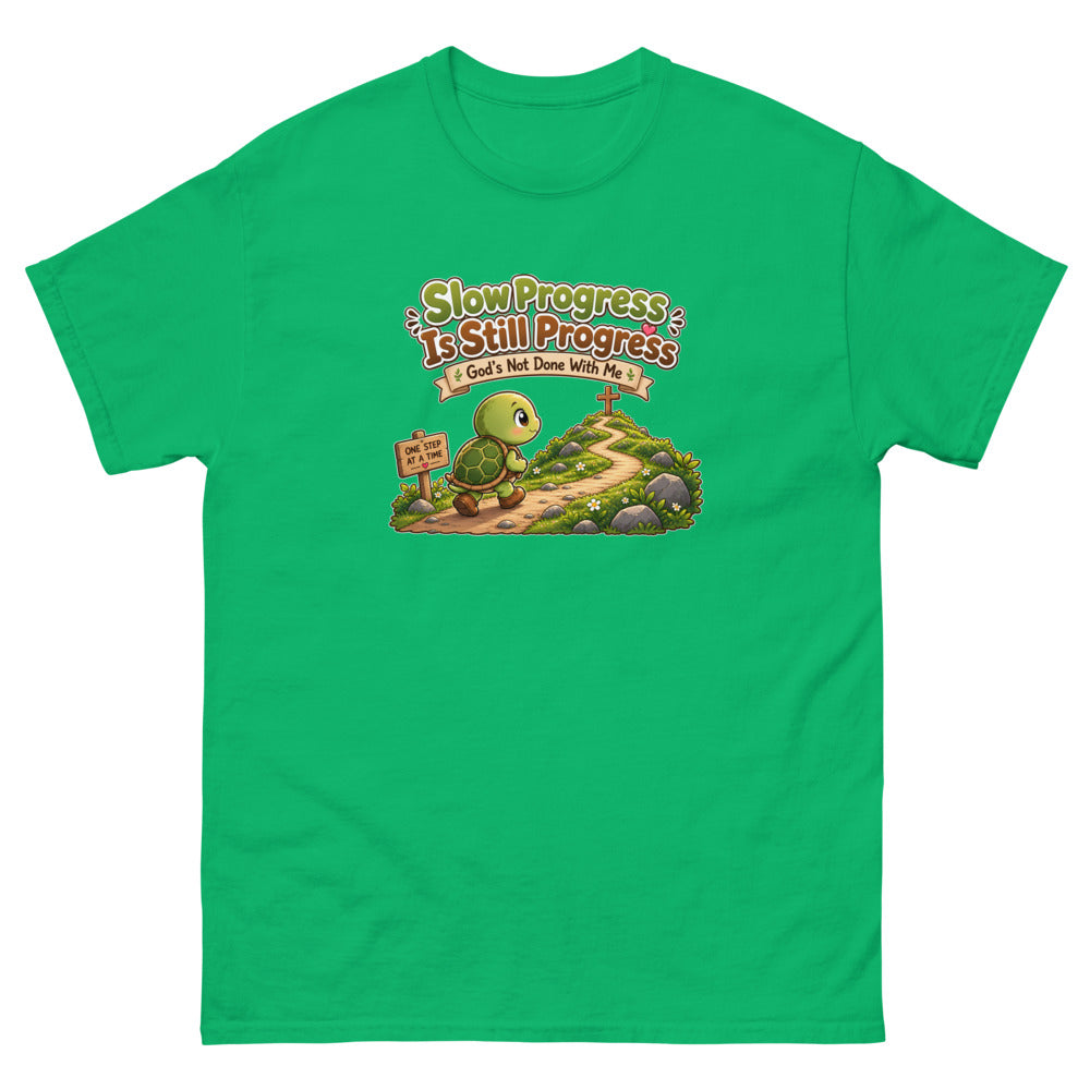 Cartoon turtle walking a path toward a cross with the words Slow Progress Is Still Progress on a Irish Green shirt