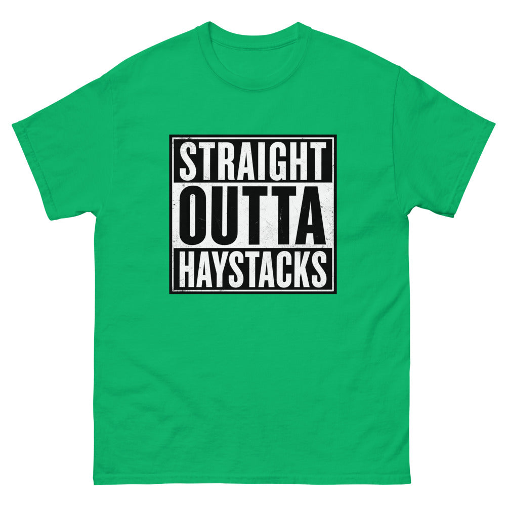 Distressed block lettering reading Straight Outta Haystacks on a Irish Green shirt
