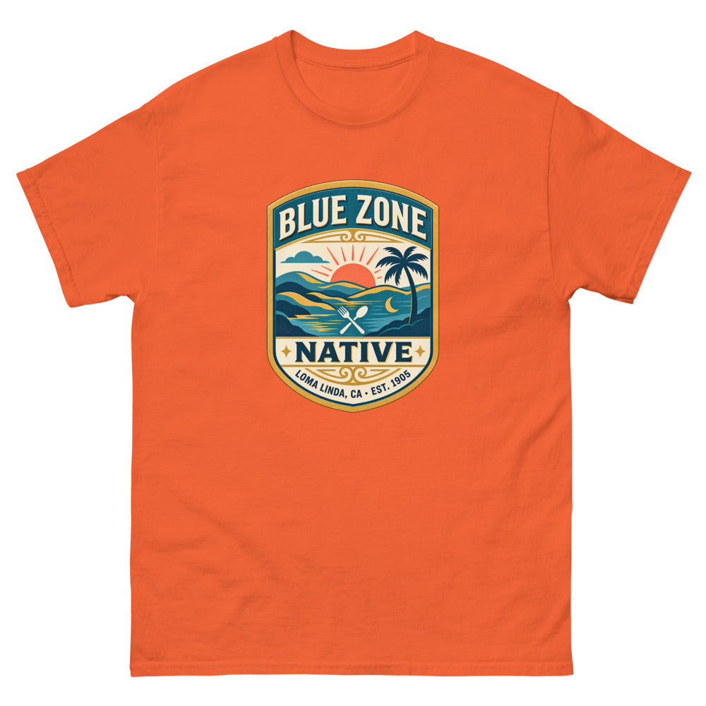 Vintage badge with a sunset and palm tree reading Blue Zone Native, Loma Linda CA on a Orange shirt