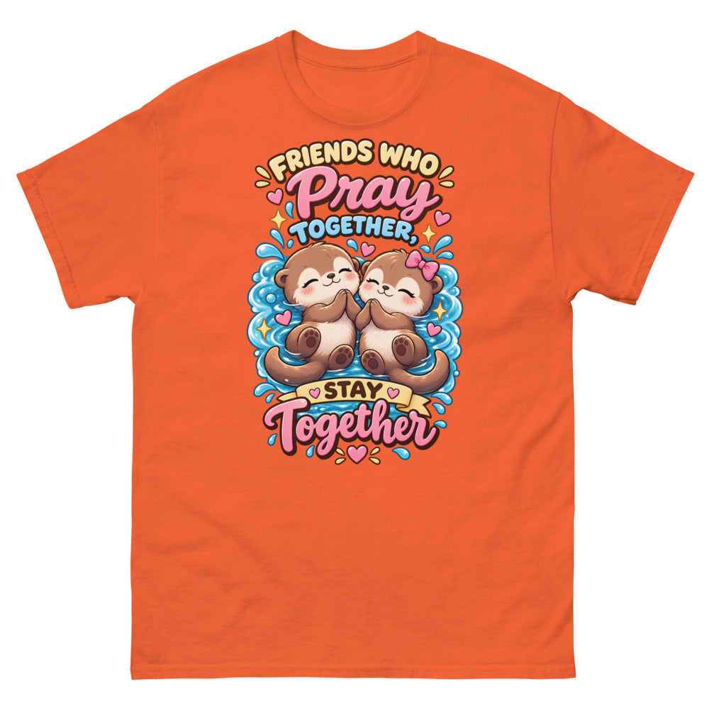Two cute otters praying together with the words Friends Who Pray Together Stay Together on a Orange shirt