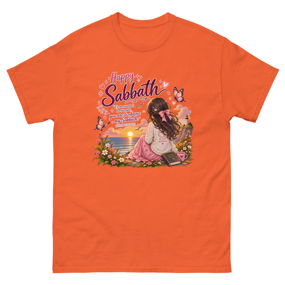 Chibi girl watching an ocean sunset with a Bible and the words Happy Sabbath on a Orange shirt
