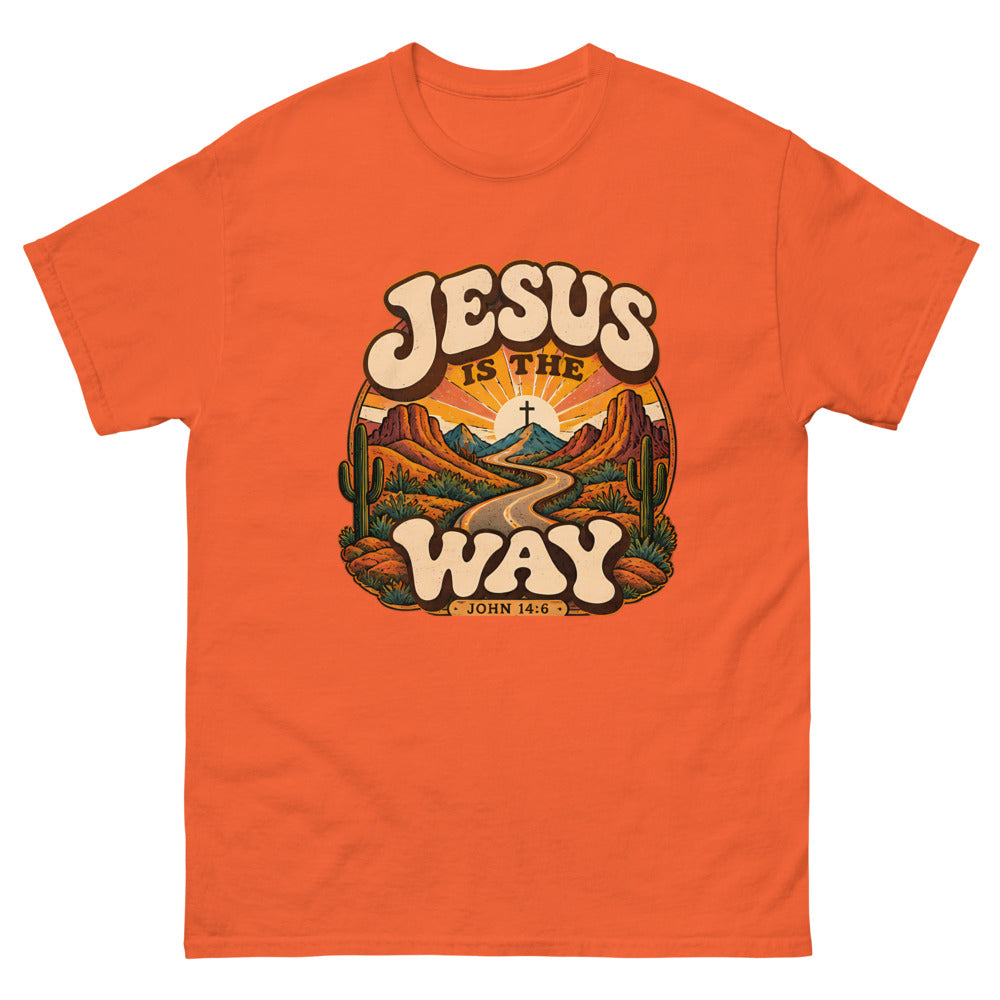 Retro groovy desert badge with a winding road to a cross reading Jesus Is The Way on a Orange shirt