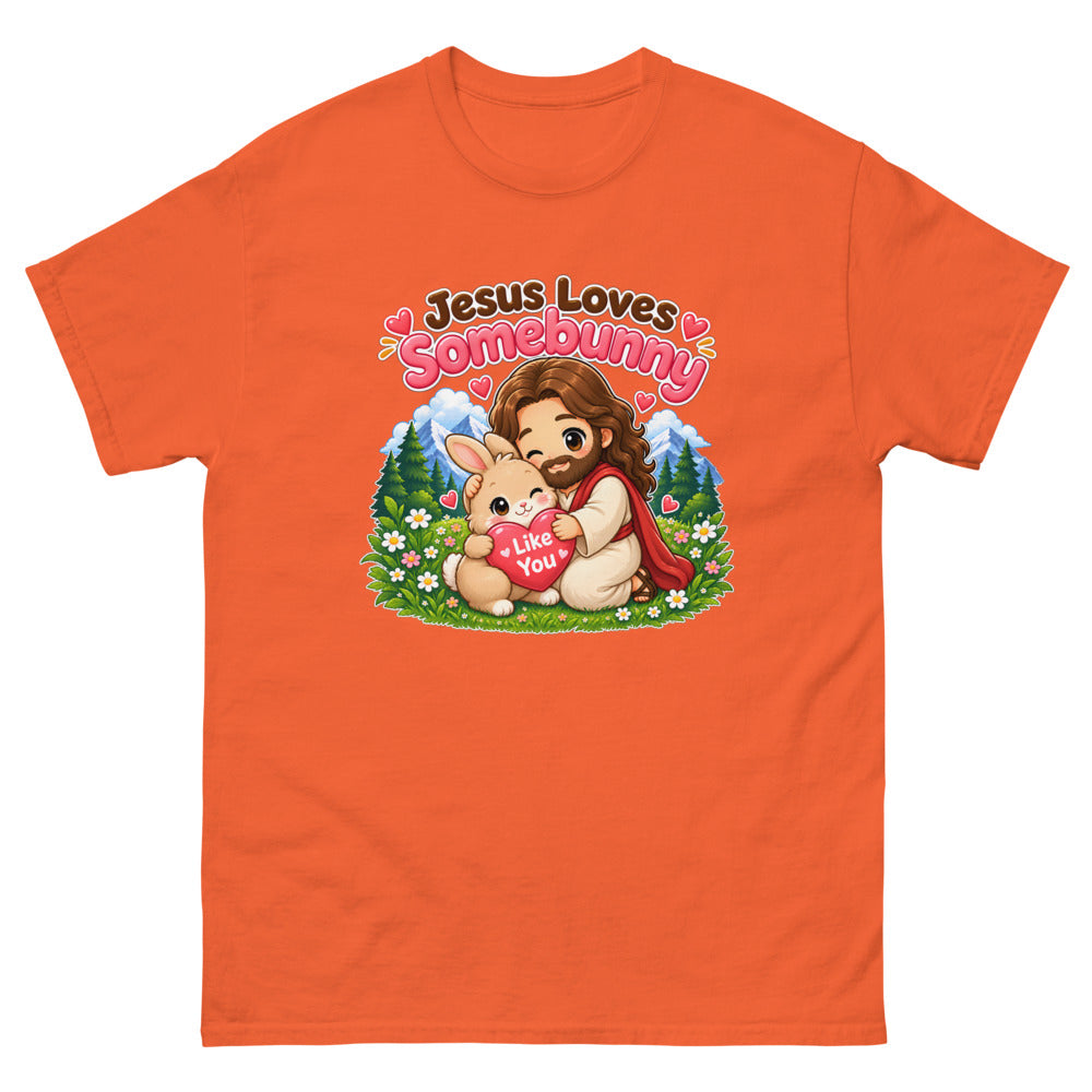Chibi Jesus hugging a bunny holding a heart with the words Jesus Loves Somebunny on a Orange shirt