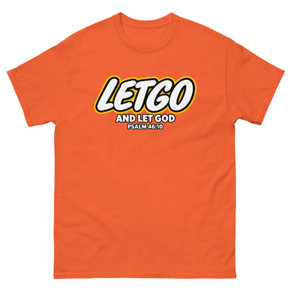Toy brick logo parody reading Letgo and Let God, Psalm 46:10 on a Orange shirt