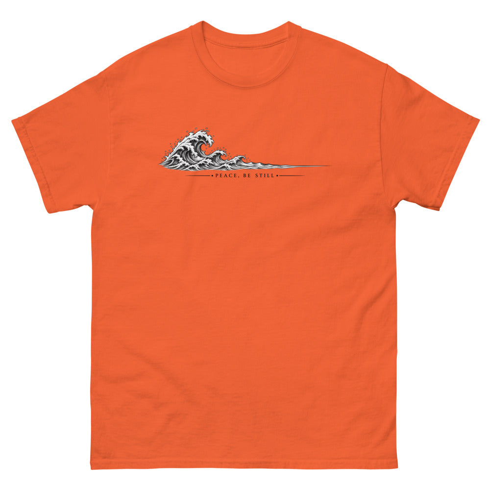 Engraved line art wave with the words Peace Be Still on a Orange shirt