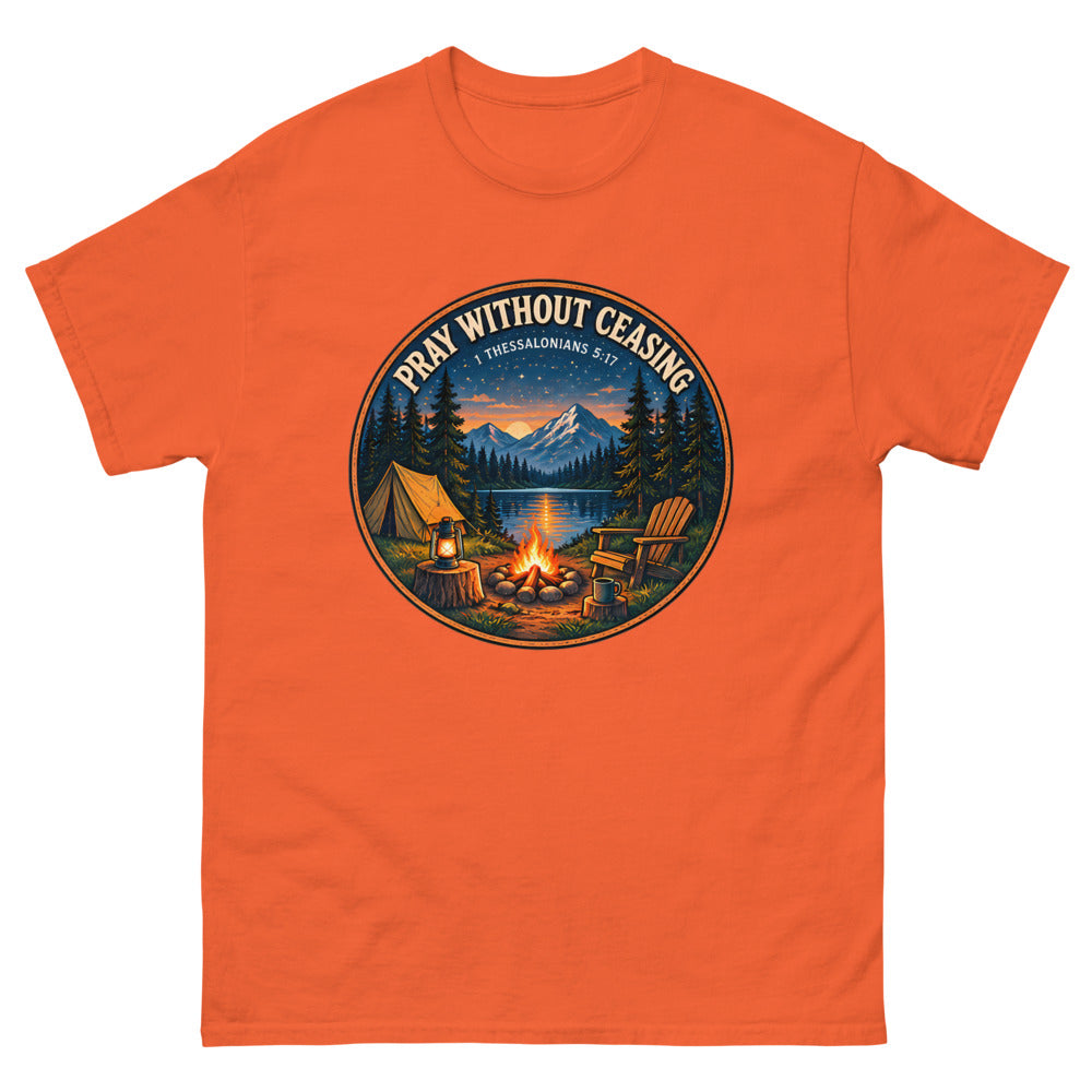 Round campfire and tent badge at night reading Pray Without Ceasing on a Orange shirt