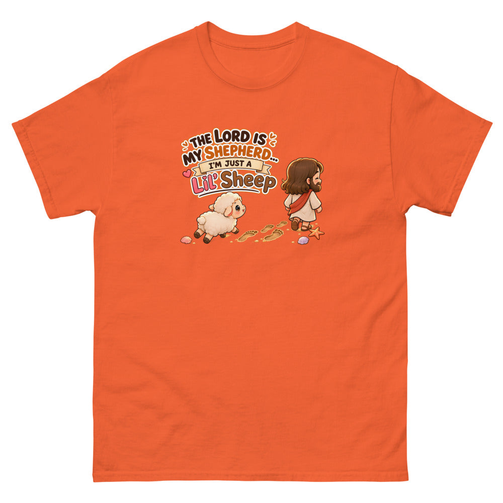 Chibi Jesus walking ahead of a little sheep with the words The Lord Is My Shepherd I'm Just A Lil Sheep on a Orange shirt