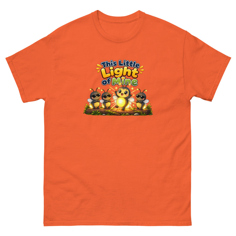 Glowing cartoon firefly with three others in sunglasses and the words This Little Light Of Mine on a Orange shirt
