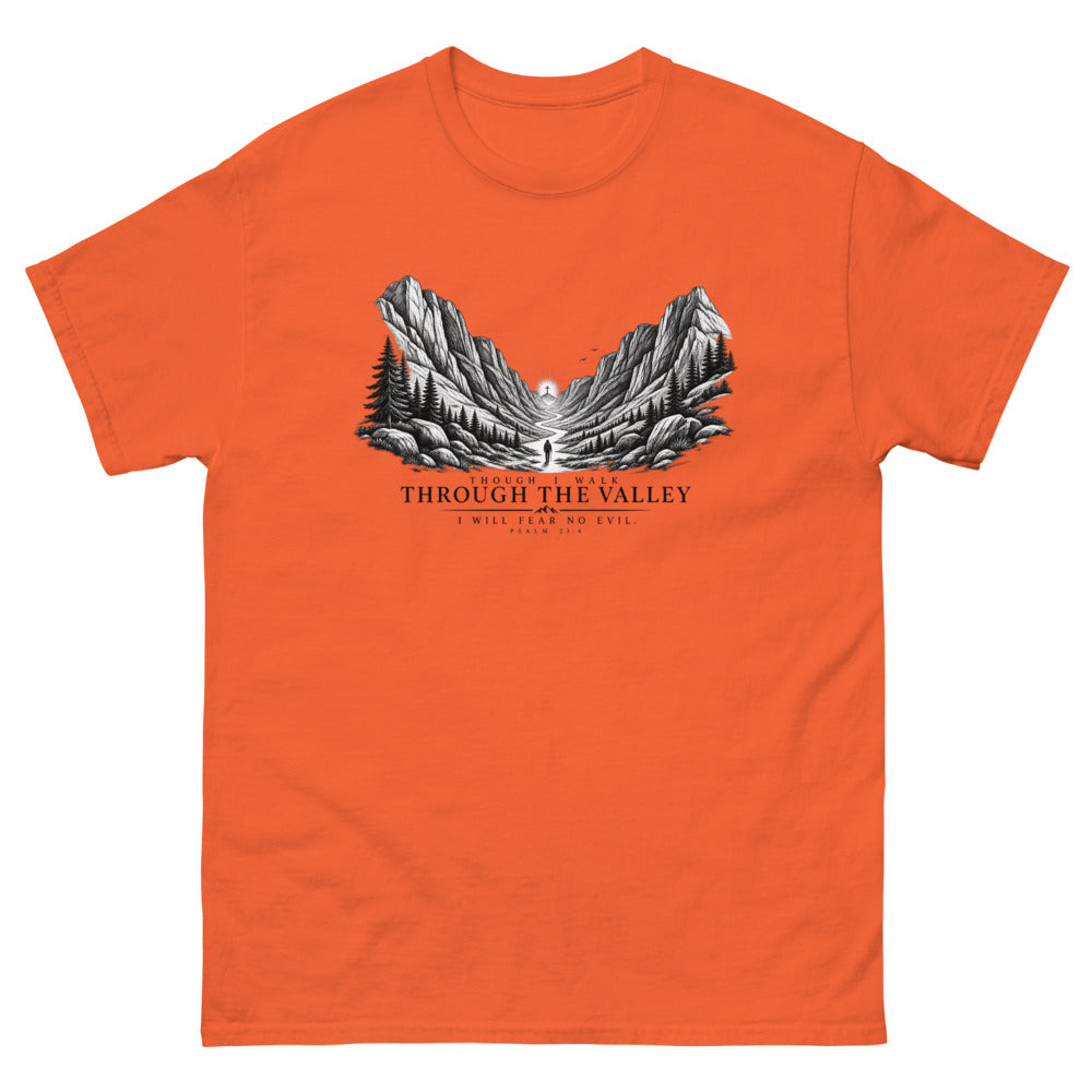Engraved mountain valley with a lone figure reading Though I Walk Through The Valley I Will Fear No Evil on a Orange shirt