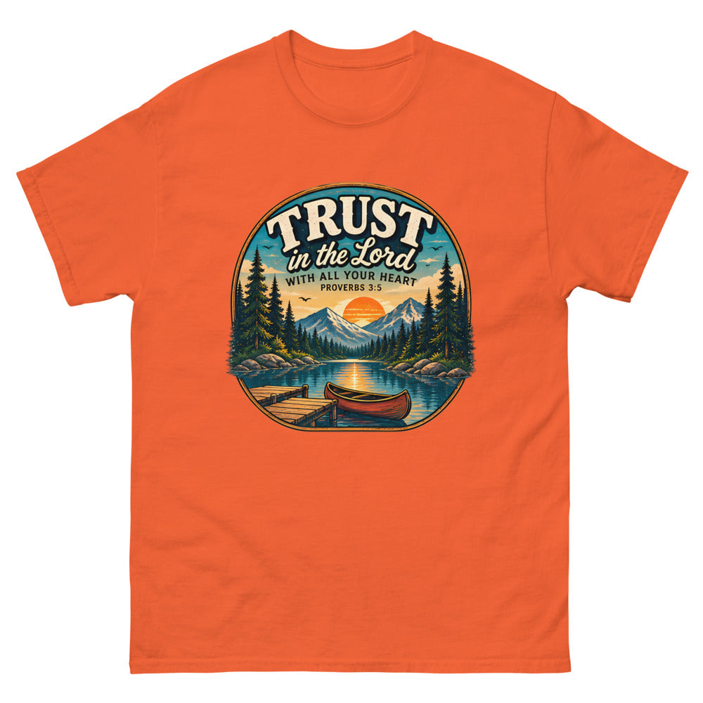 Round lakeside badge with a canoe and dock reading Trust In The Lord With All Your Heart on a Orange shirt