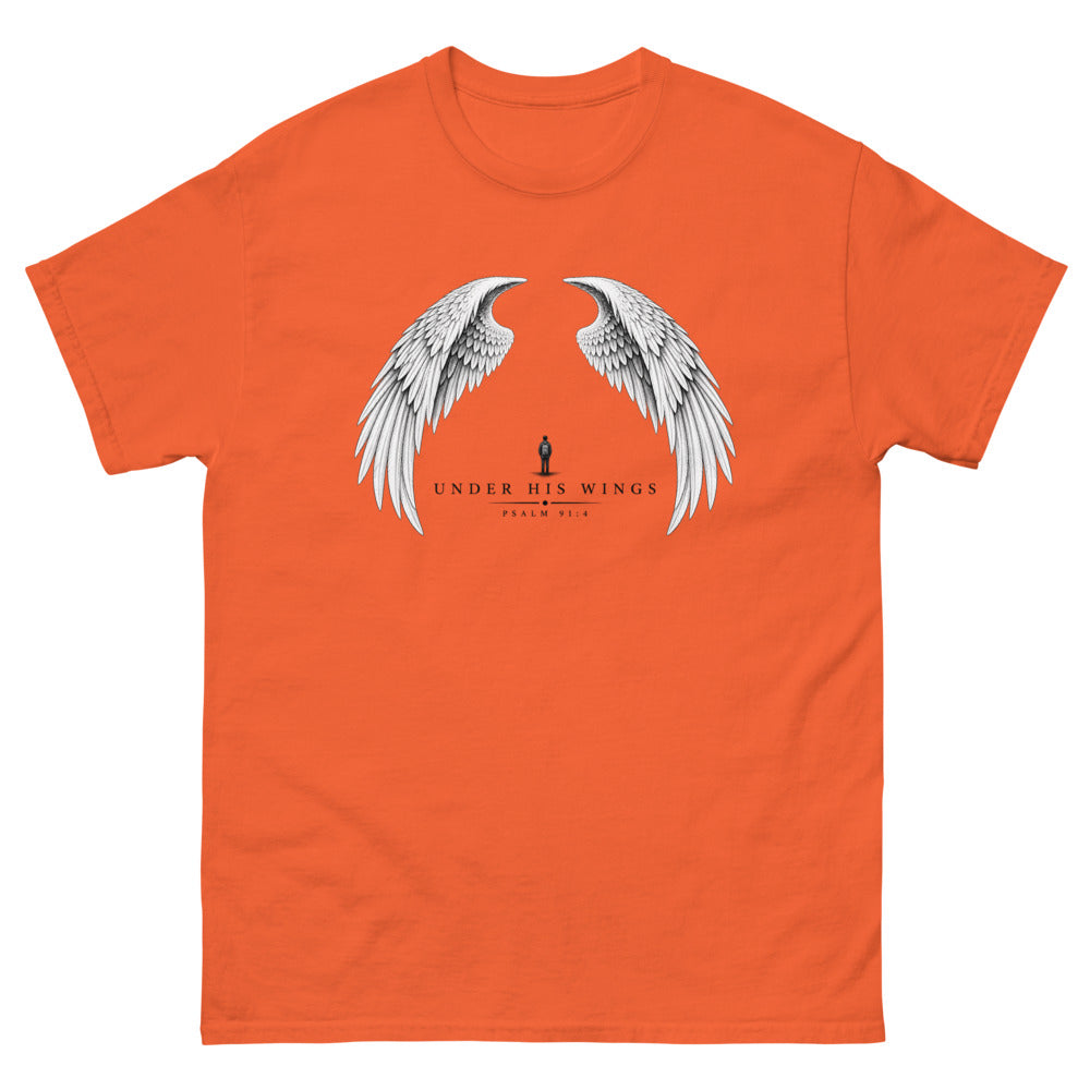 Line art angel wings with a small figure between them and the words Under His Wings on a Orange shirt
