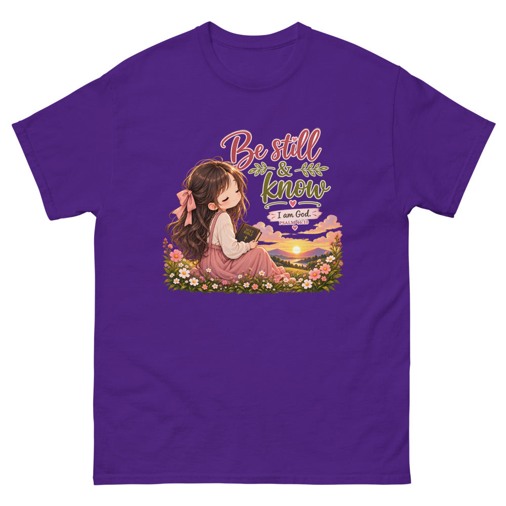 Chibi girl in a flower field holding a Bible with the words Be Still And Know on a Purple shirt