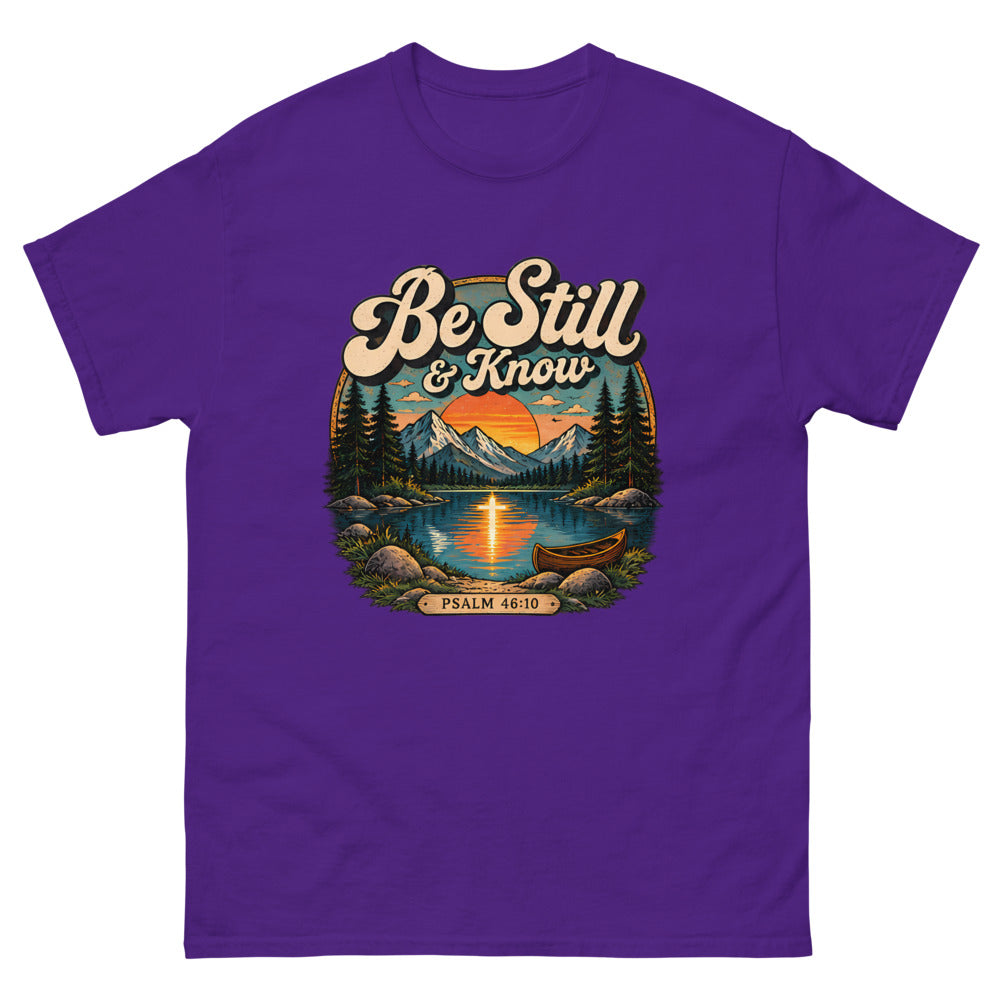 Retro lake and canoe scene at sunset reading Be Still And Know on a Purple shirt