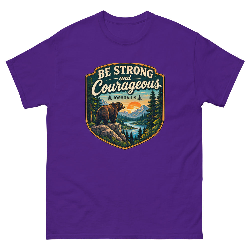 Shield badge with a bear on a rock reading Be Strong And Courageous on a Purple shirt