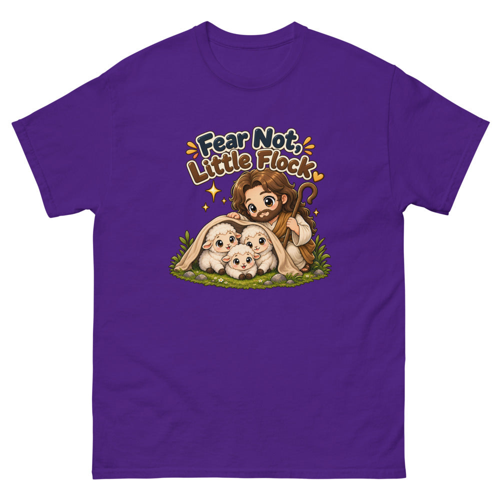 Chibi Jesus tucking a blanket around three sheep with the words Fear Not Little Flock on a Purple shirt