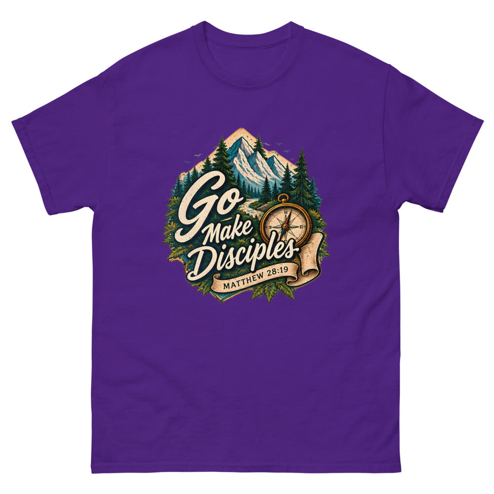 Compass over a mountain trail badge reading Go Make Disciples on a Purple shirt