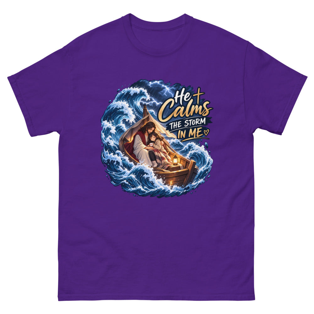 Jesus holding a young woman in a boat during a storm with the words He Calms The Storm In Me on a Purple shirt
