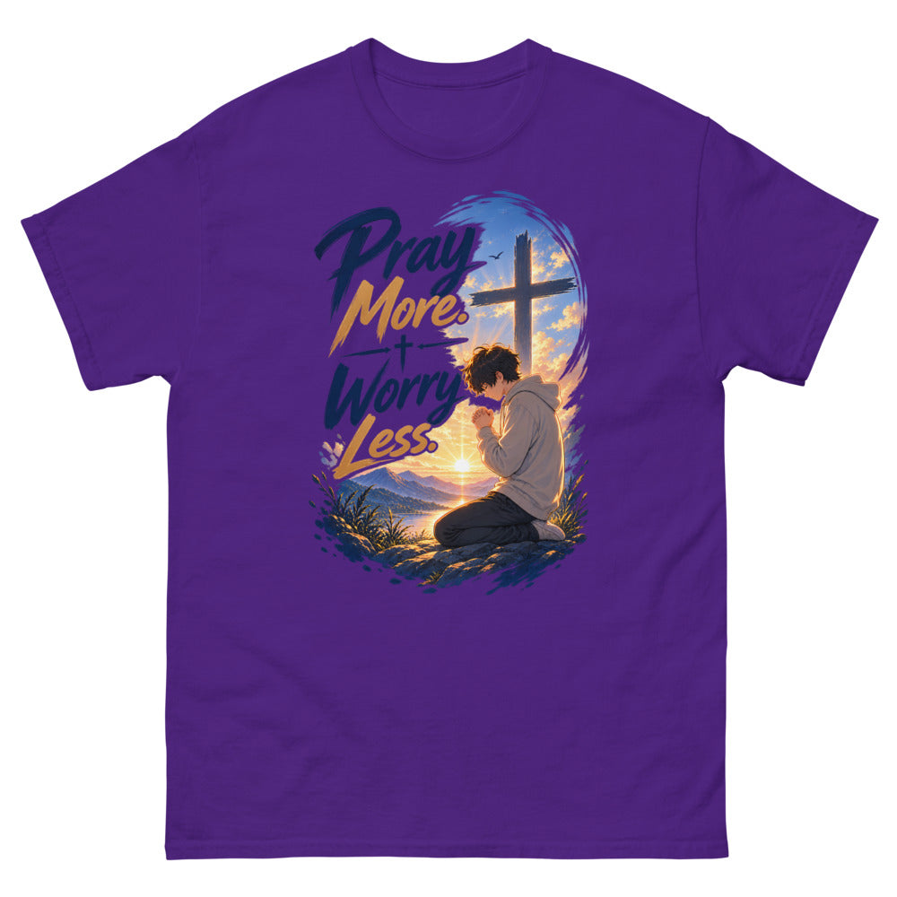 Anime boy kneeling in prayer at sunrise beneath a cross with the words Pray More Worry Less on a Purple shirt