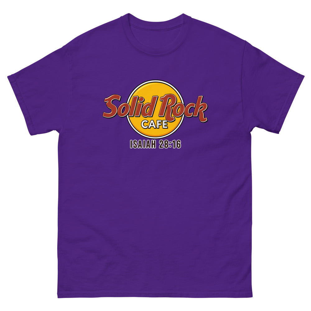 Gold roundel reading Solid Rock Cafe with Isaiah 28:16 on a Purple shirt