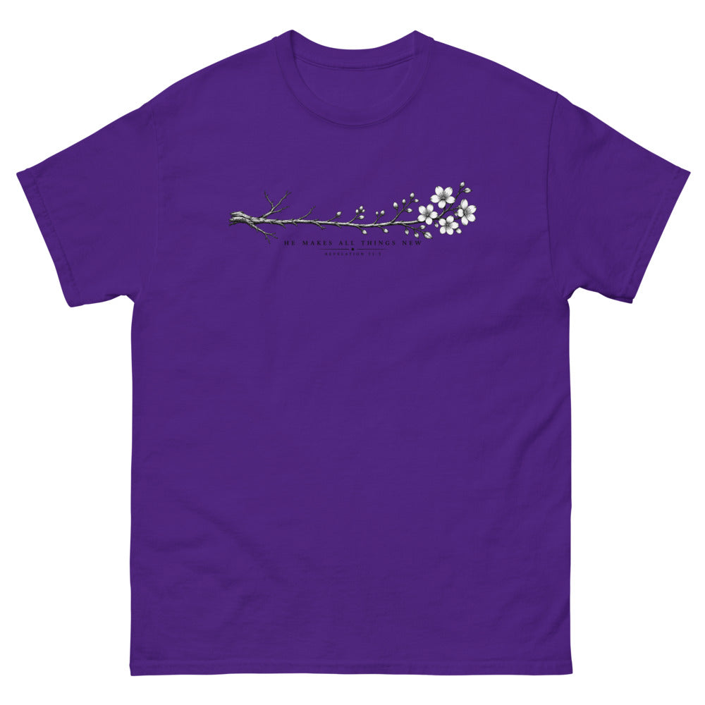 Line art branch flowering from bare to bloom with the words He Makes All Things New on a Purple shirt