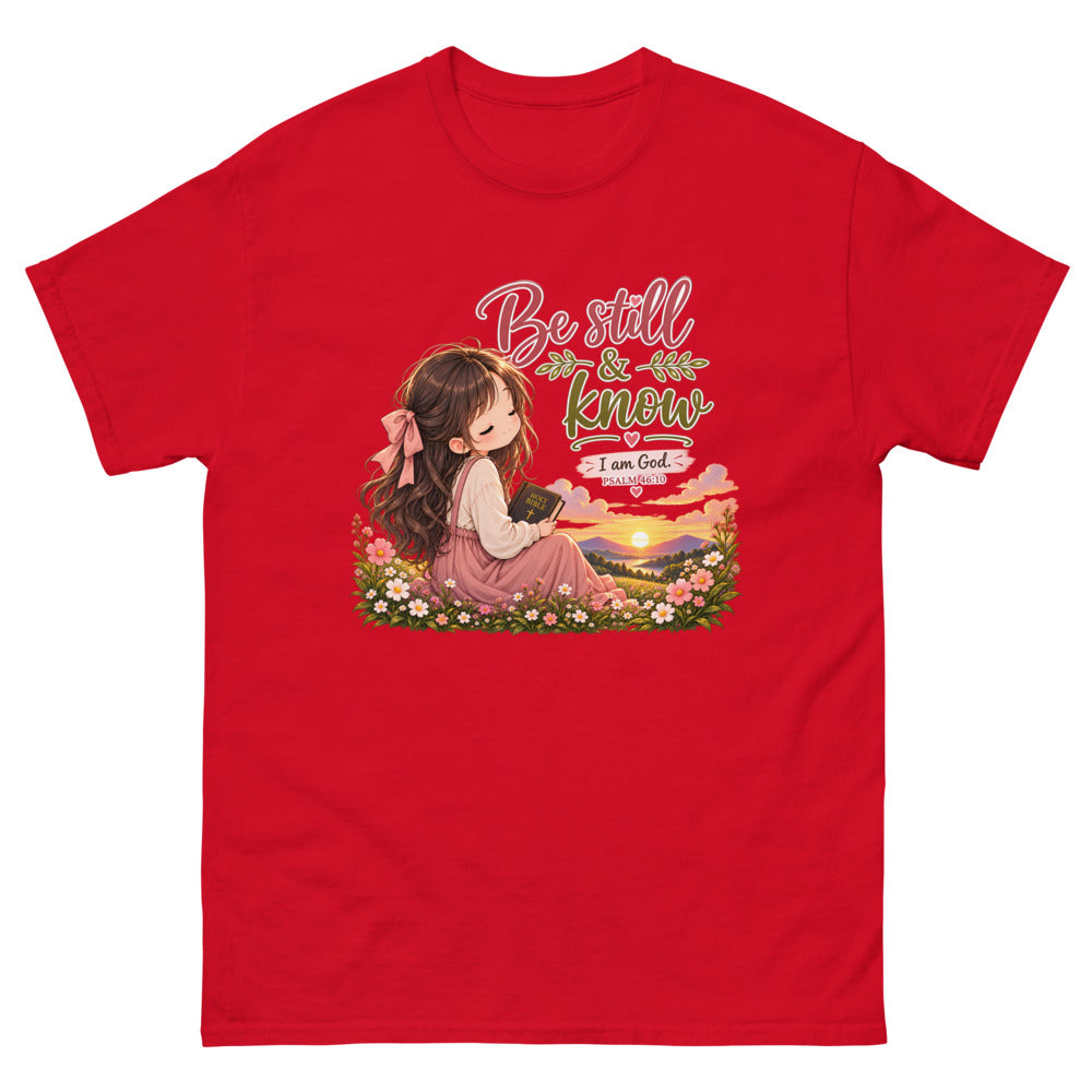 Chibi girl in a flower field holding a Bible with the words Be Still And Know on a Red shirt