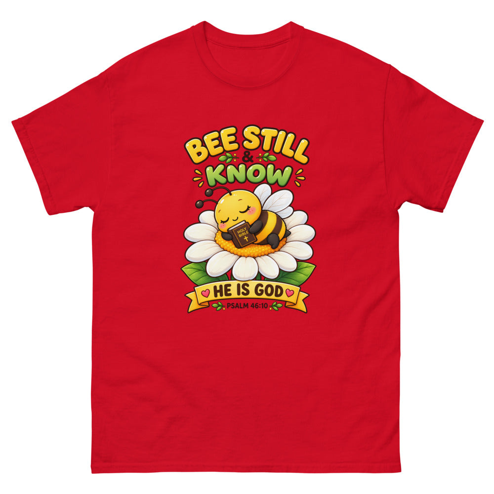 Cartoon bee sleeping on a daisy with a Bible and the words Bee Still And Know on a Red shirt