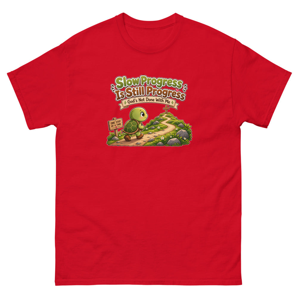 Cartoon turtle walking a path toward a cross with the words Slow Progress Is Still Progress on a Red shirt